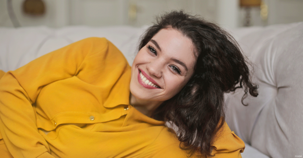 Woman smiling realizing there is another way to get her pre-baby body than working out