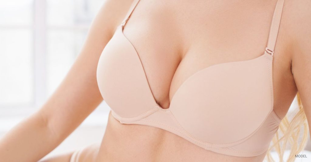 Woman (model) close up of chest wearing a bra.